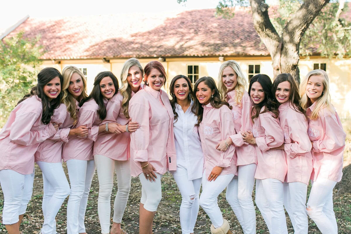 bridesmaids in matching monogrammed outfits