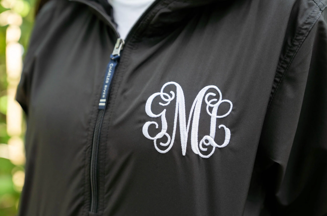black monogrammed rain jacket pullover