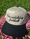 he's watching football trucker hat