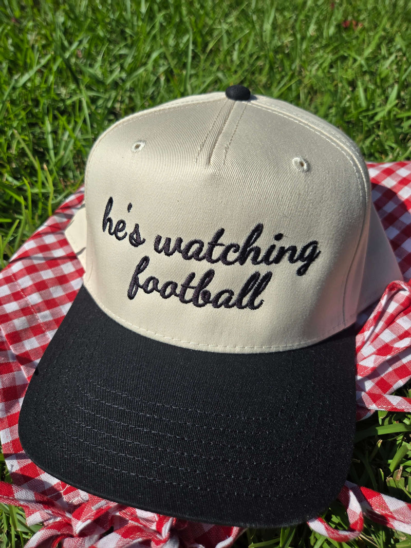 he's watching football trucker hat