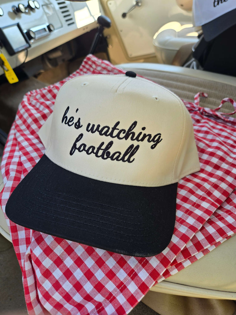he's watching football trucker hat