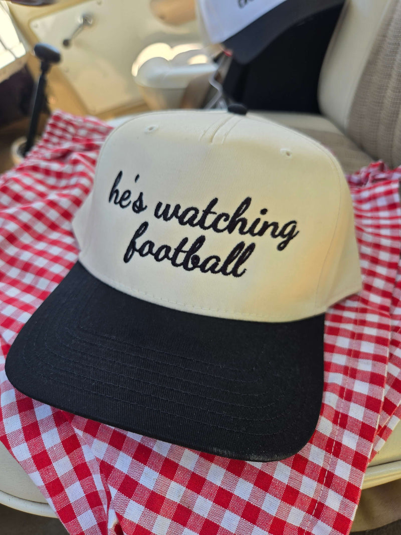 he's watching football trucker hat