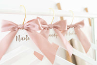 personalized bridesmaid hangers with engraved names and bow