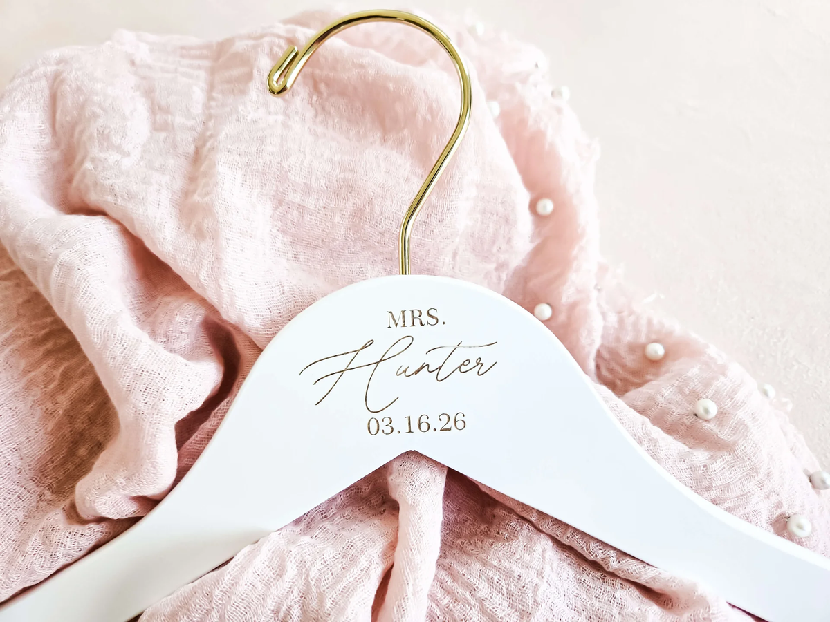 personalized white hanger with bride’s name and wedding date