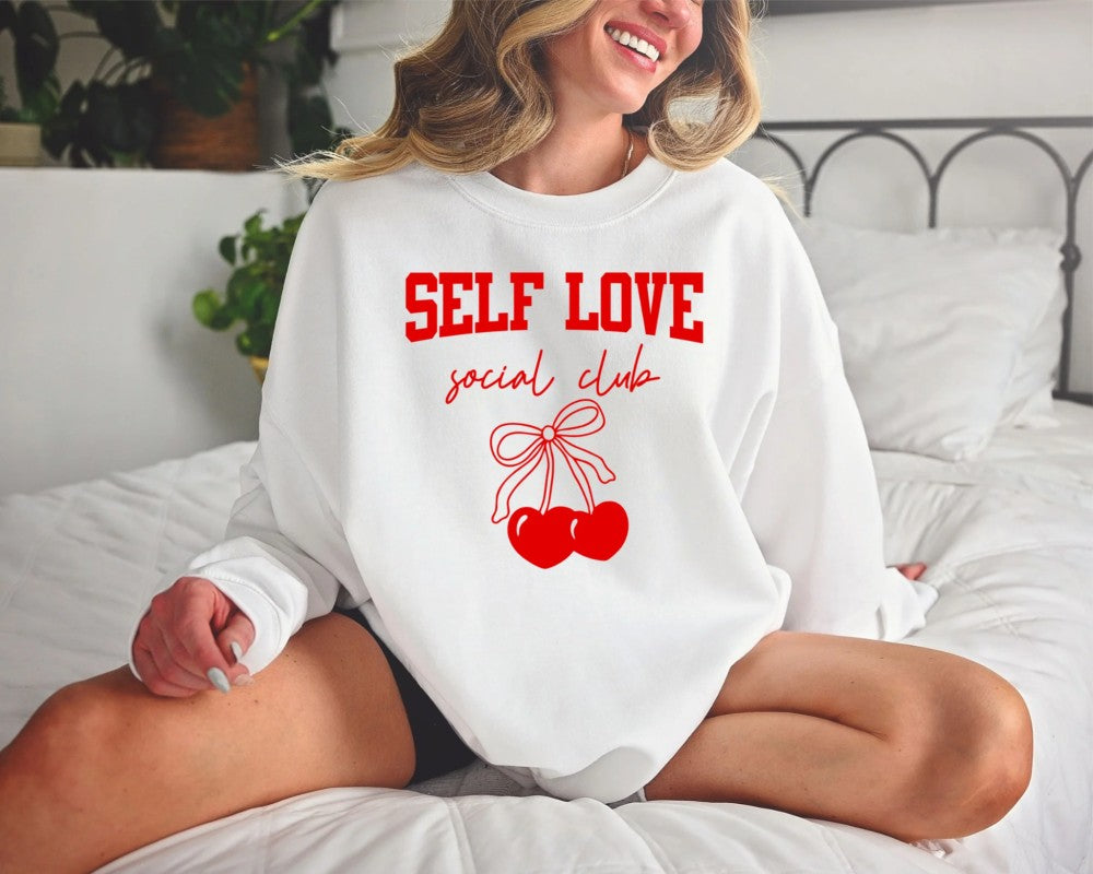 Woman in a white & red bow sweatshirt
